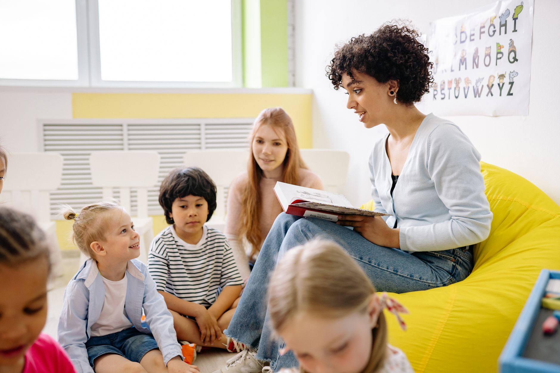 A Little Banyan educator with children