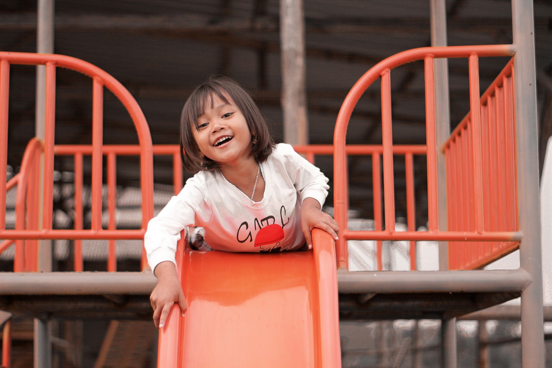 Singapore children playing happily outdoors in nature at Little Banyan Preschool