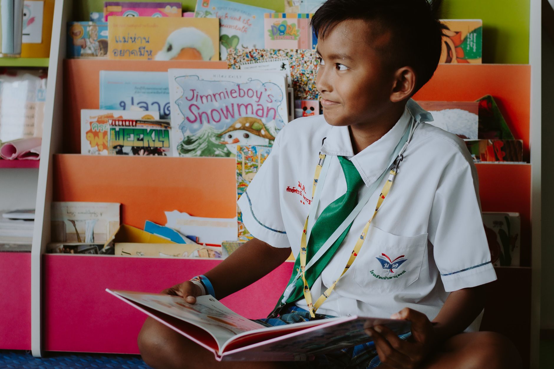 A child reading at Little Banyan Preschool