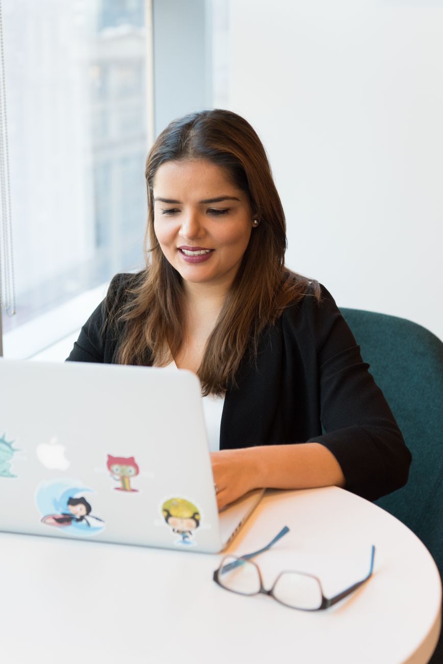 A career switcher learning to code on a laptop at Bytecraft Academy in Singapore
