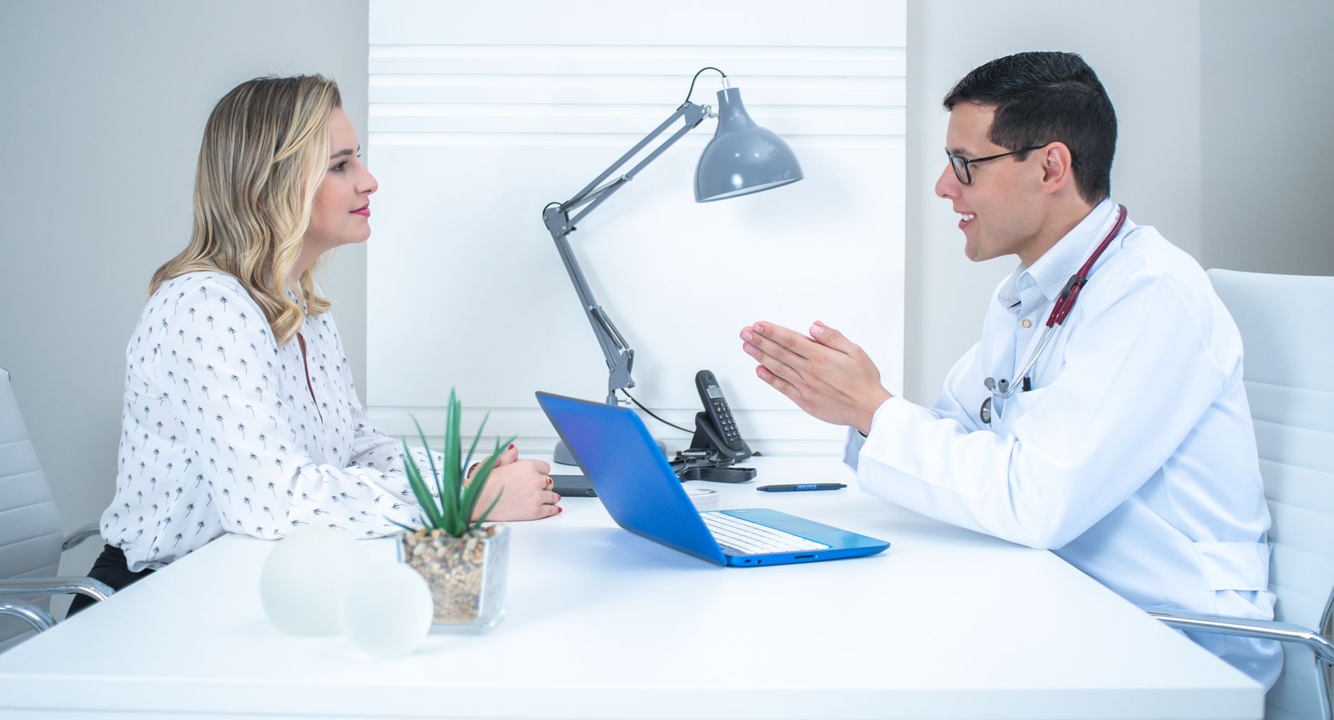 A dermatologist in consultation with a patient at Clearbrook Singapore