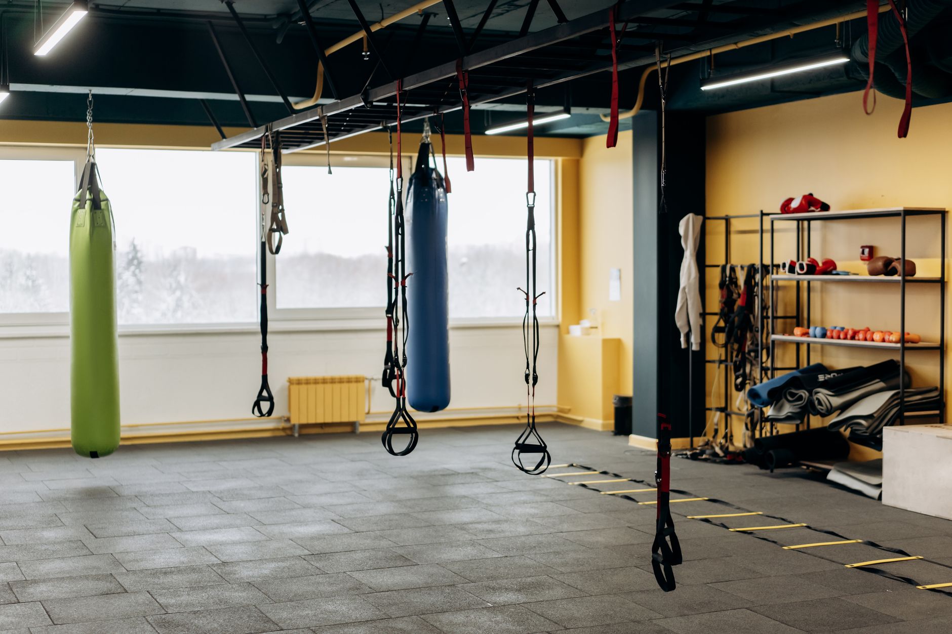 Inside the Clinch Muay Thai gym in Singapore — heavy bags and a training ring