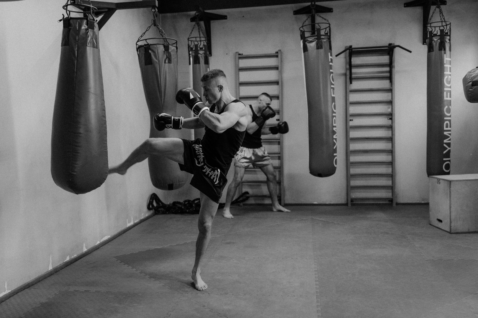 Pad work during training at Clinch Muay Thai Singapore