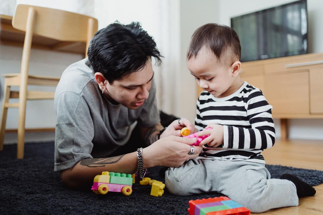 Parent and child playing together