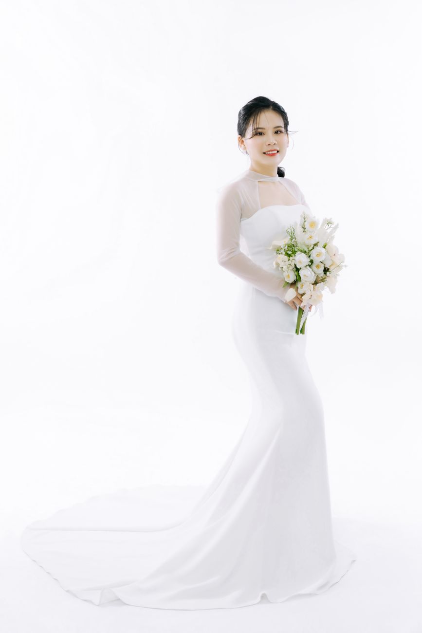 Theresa — a tea-length swing gown in embroidered organza