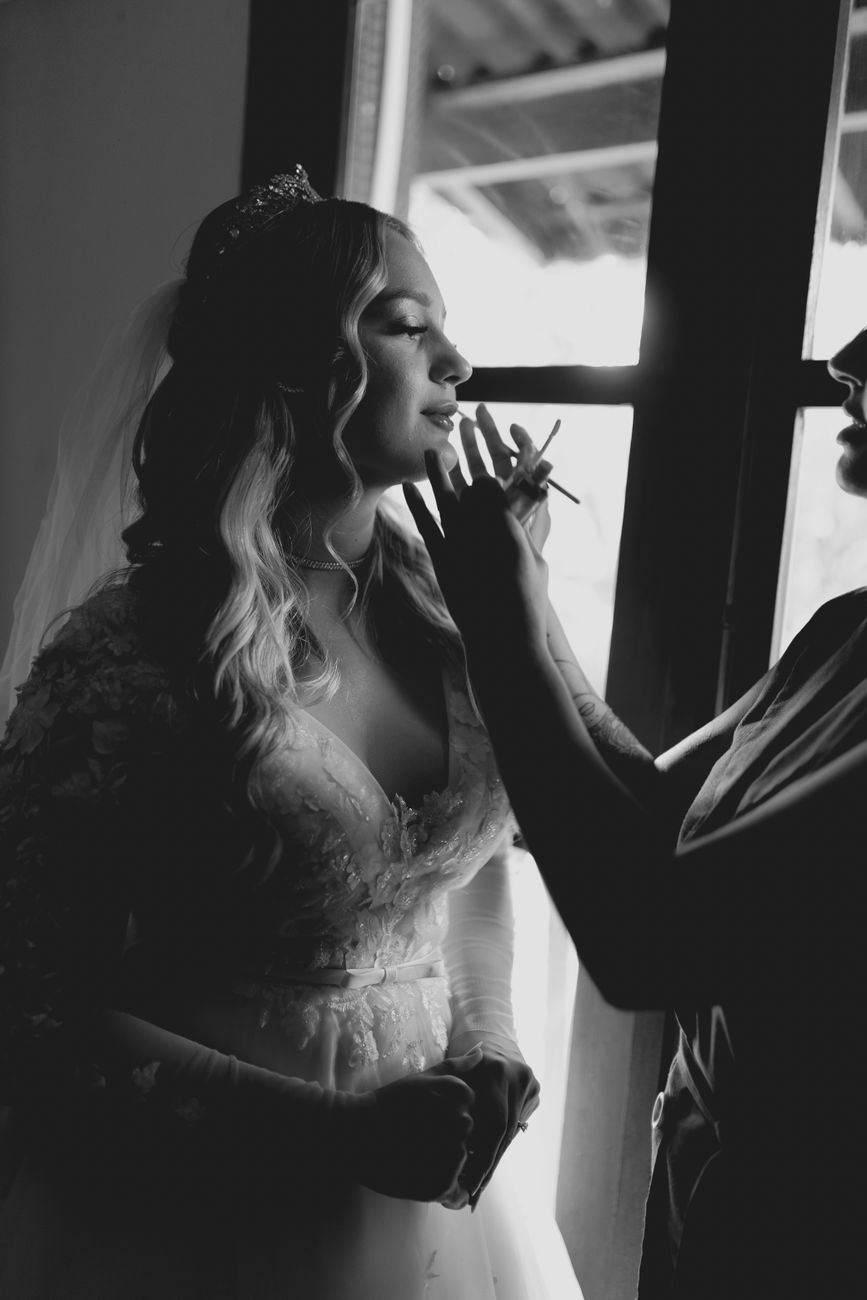 A bride being prepared at the Ivory & Lace atelier