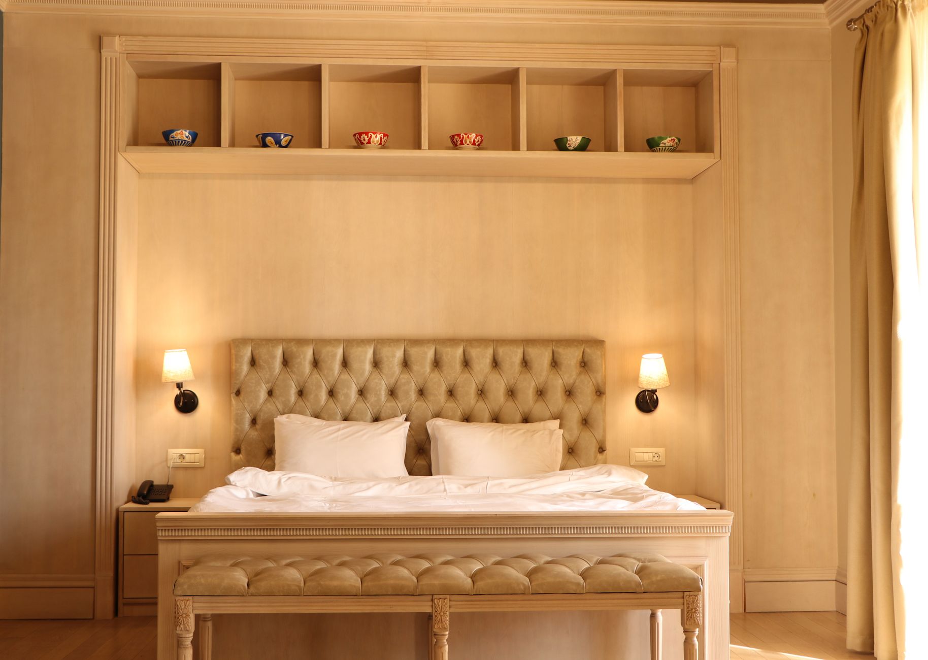 A warm, lamplit room inside a restored Singapore heritage shophouse