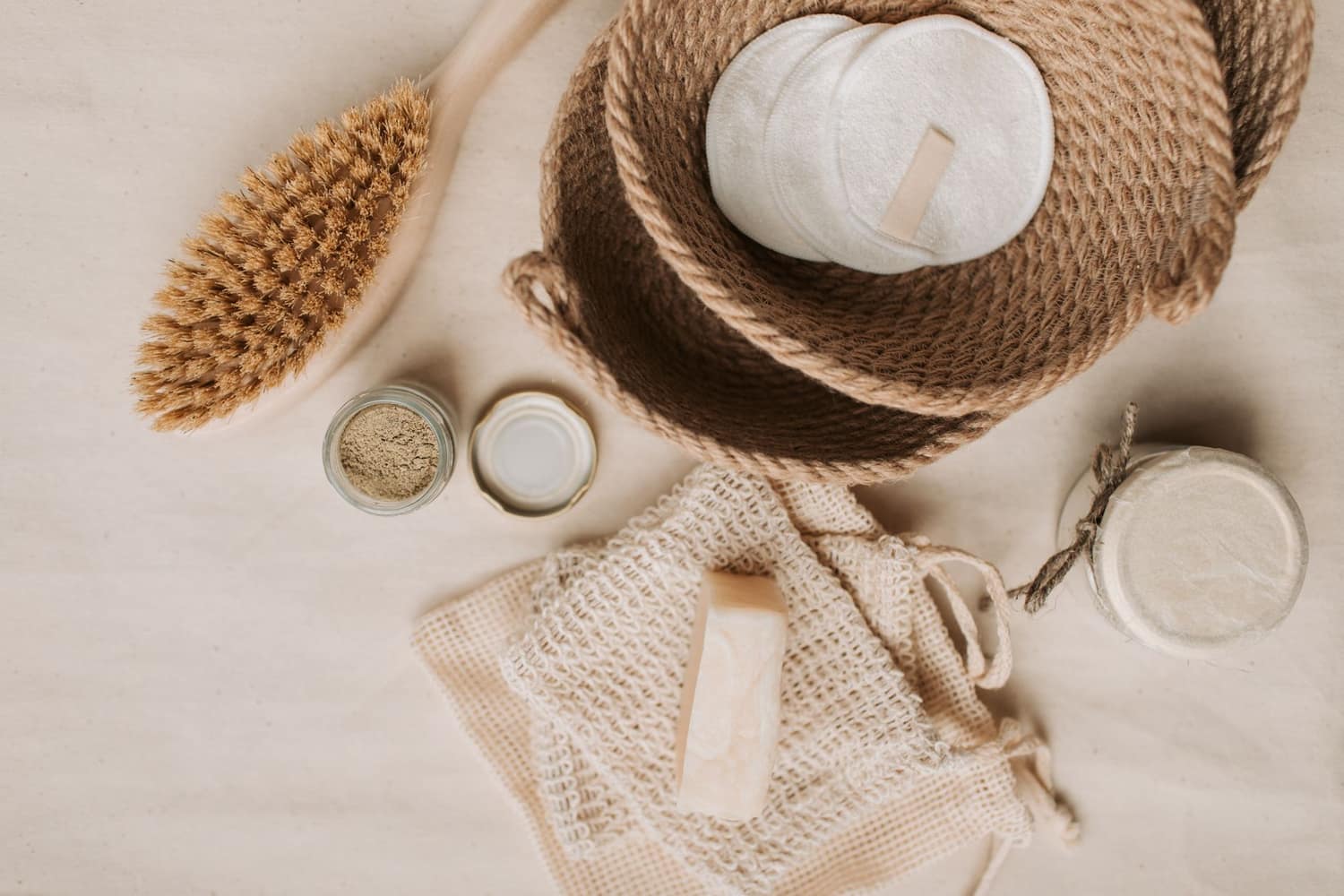 Botanical skincare laid out on a linen surface