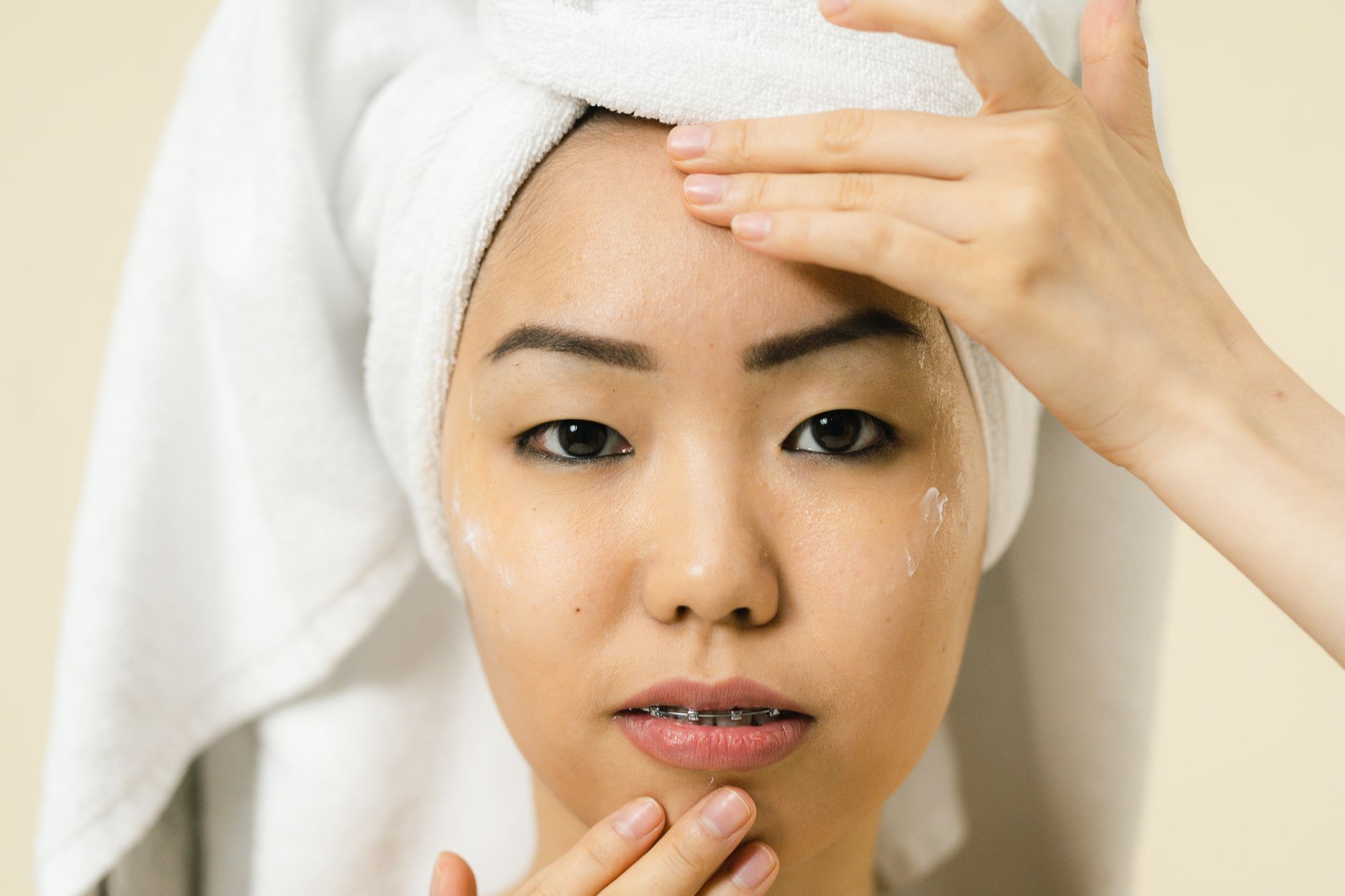 An Asian woman with calm, glowing skin after a Lumea facial