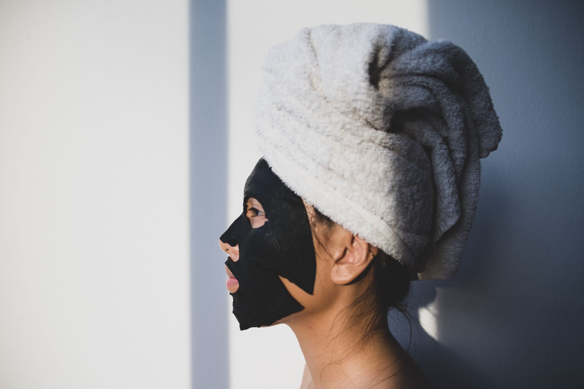A guest relaxing with a treatment mask during a Lumea facial
