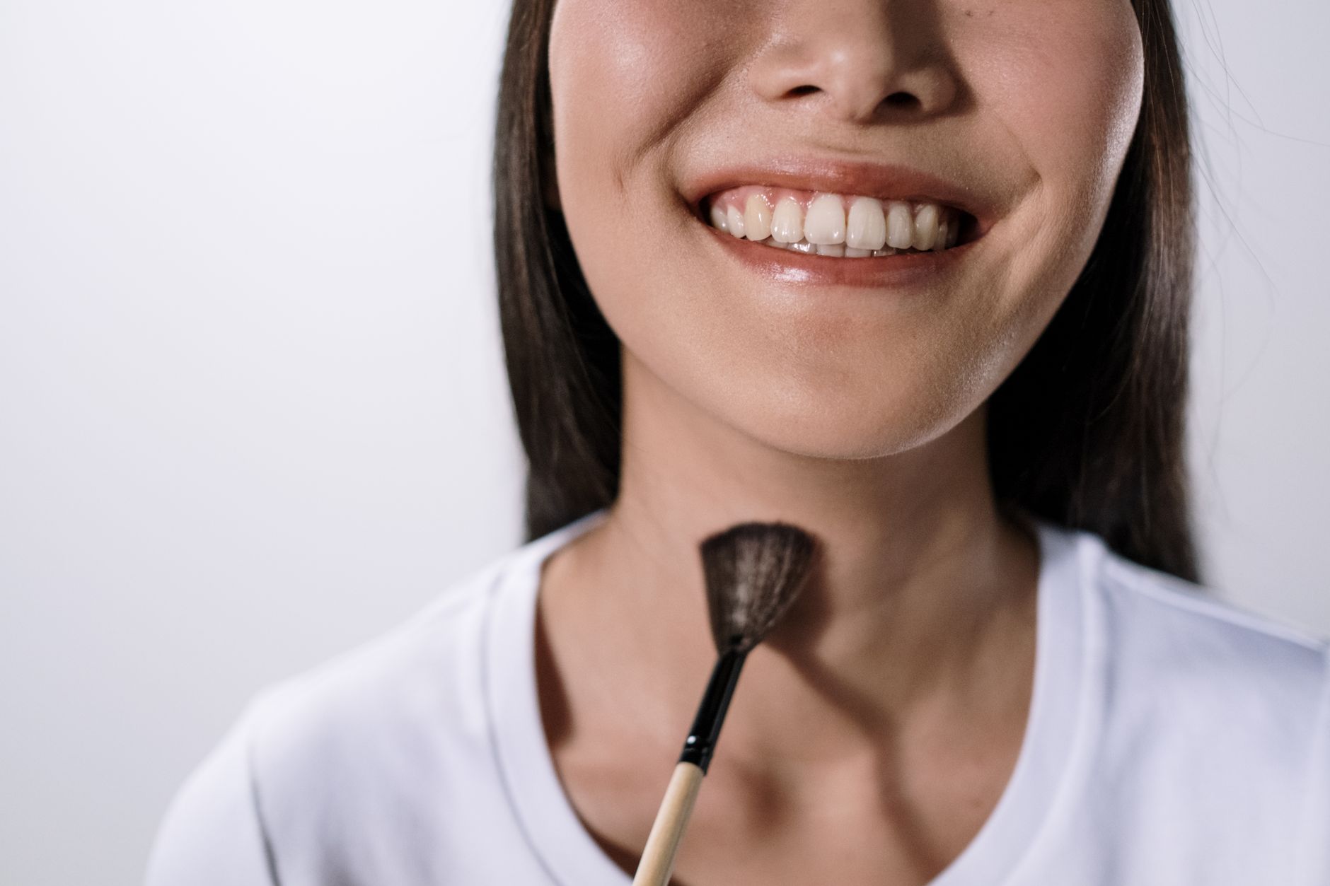 A patient smiling confidently after dental care at Lumio Dental Singapore