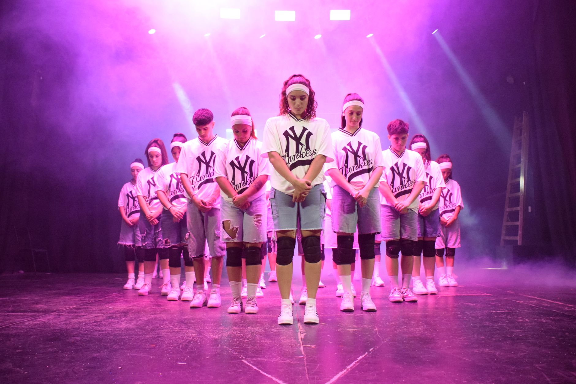 A Mainstage Dance crew mid-performance under stage lights in Singapore
