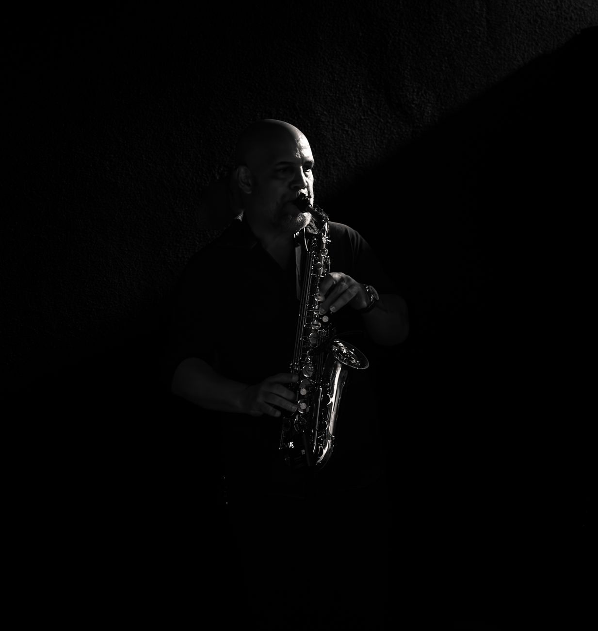 A saxophonist playing at a corporate event