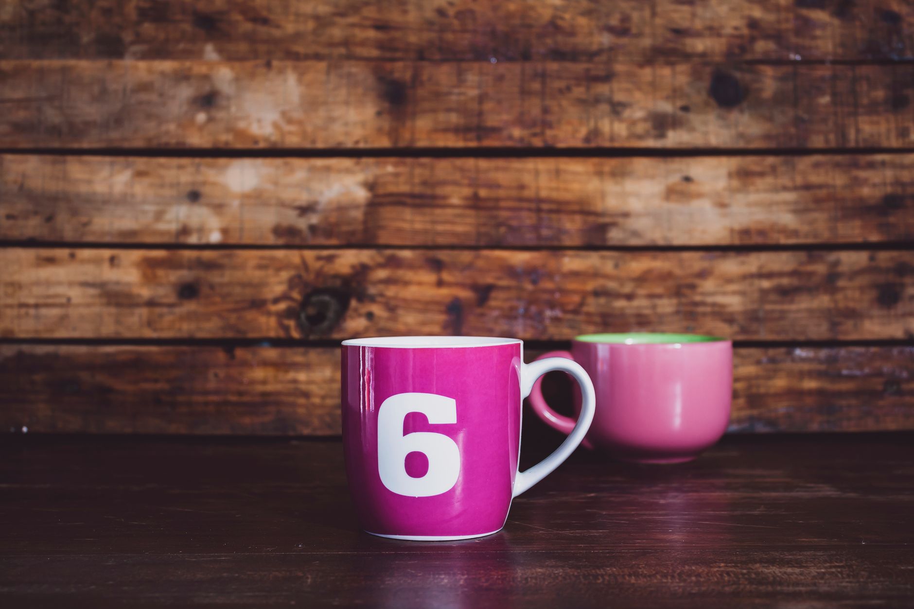 Collection of colourful custom-printed mugs and drinkware by Mugshot Singapore