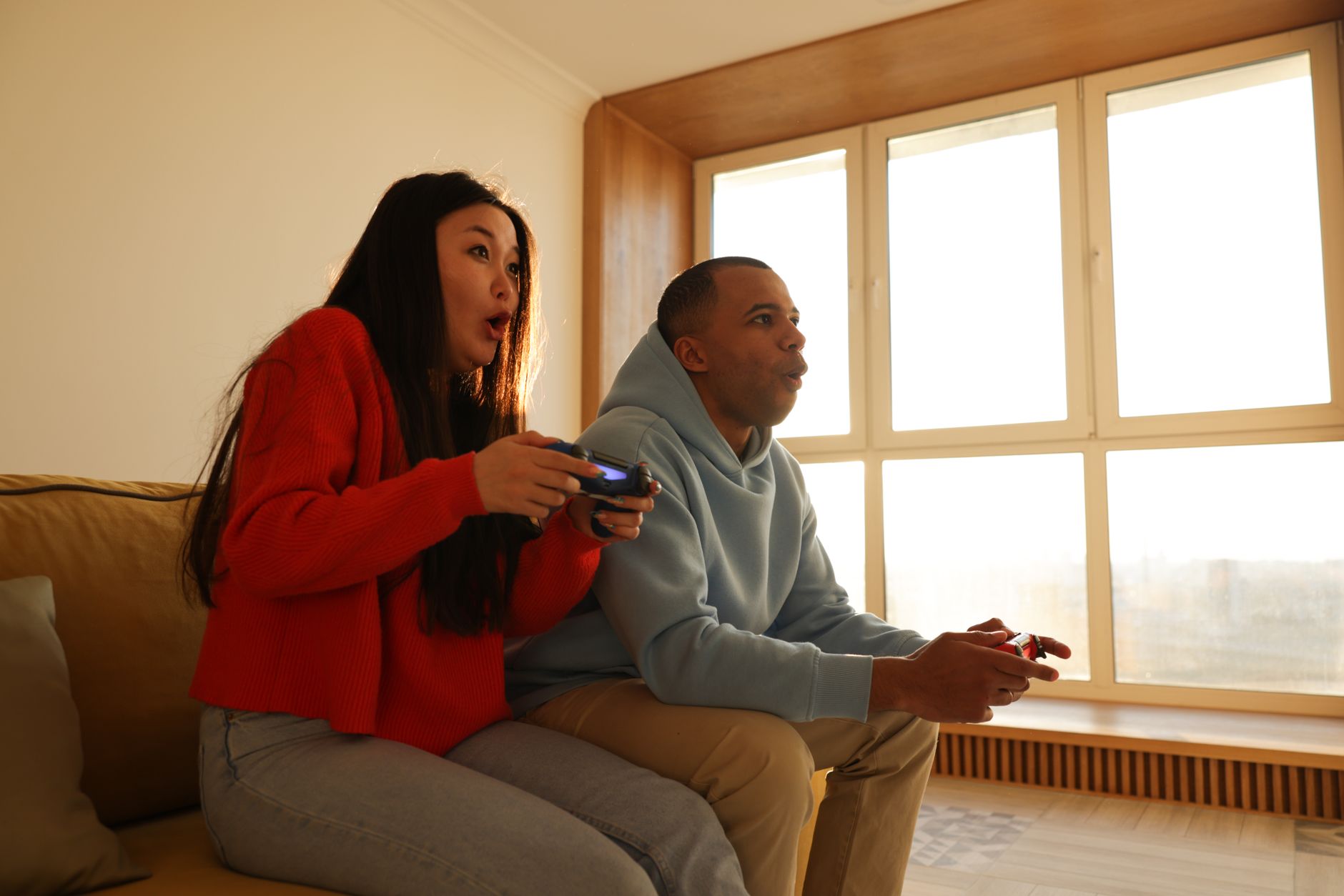 A Singapore couple reviewing overseas property options at home with Northcrest Global