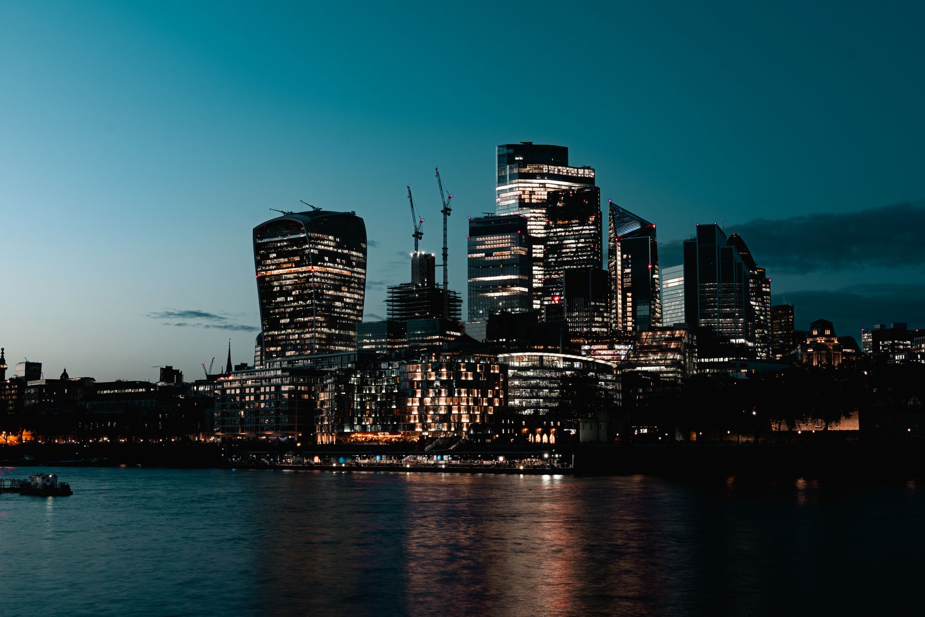 An international city skyline at dusk — overseas property markets advised by Northcrest Global for Singapore investors