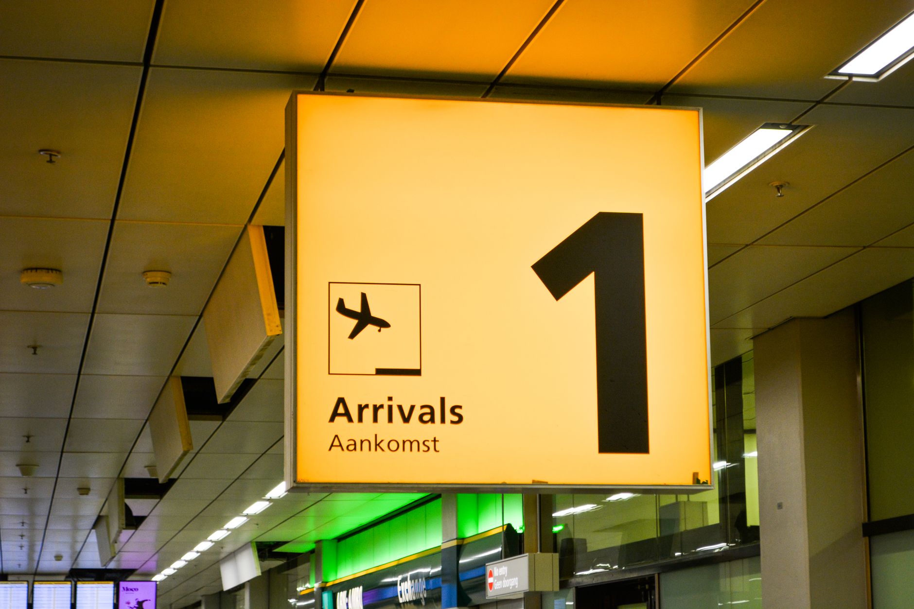 An Onyx chauffeur waiting at Changi arrivals with a name board