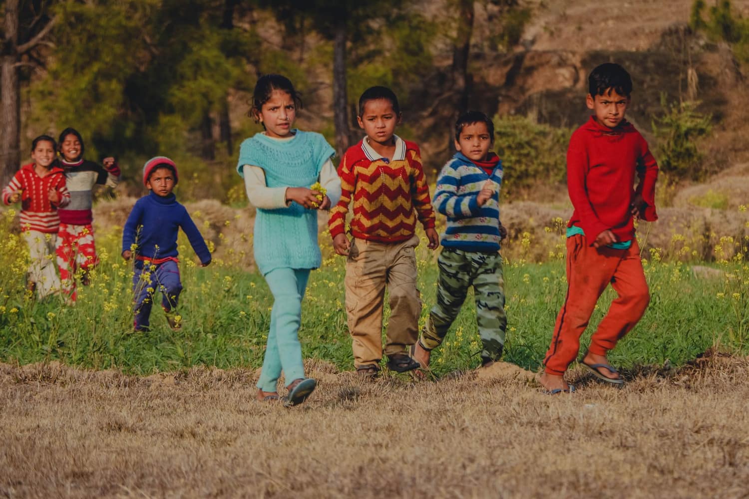 Children in bright, comfortable Pipsqueak clothes playing outdoors