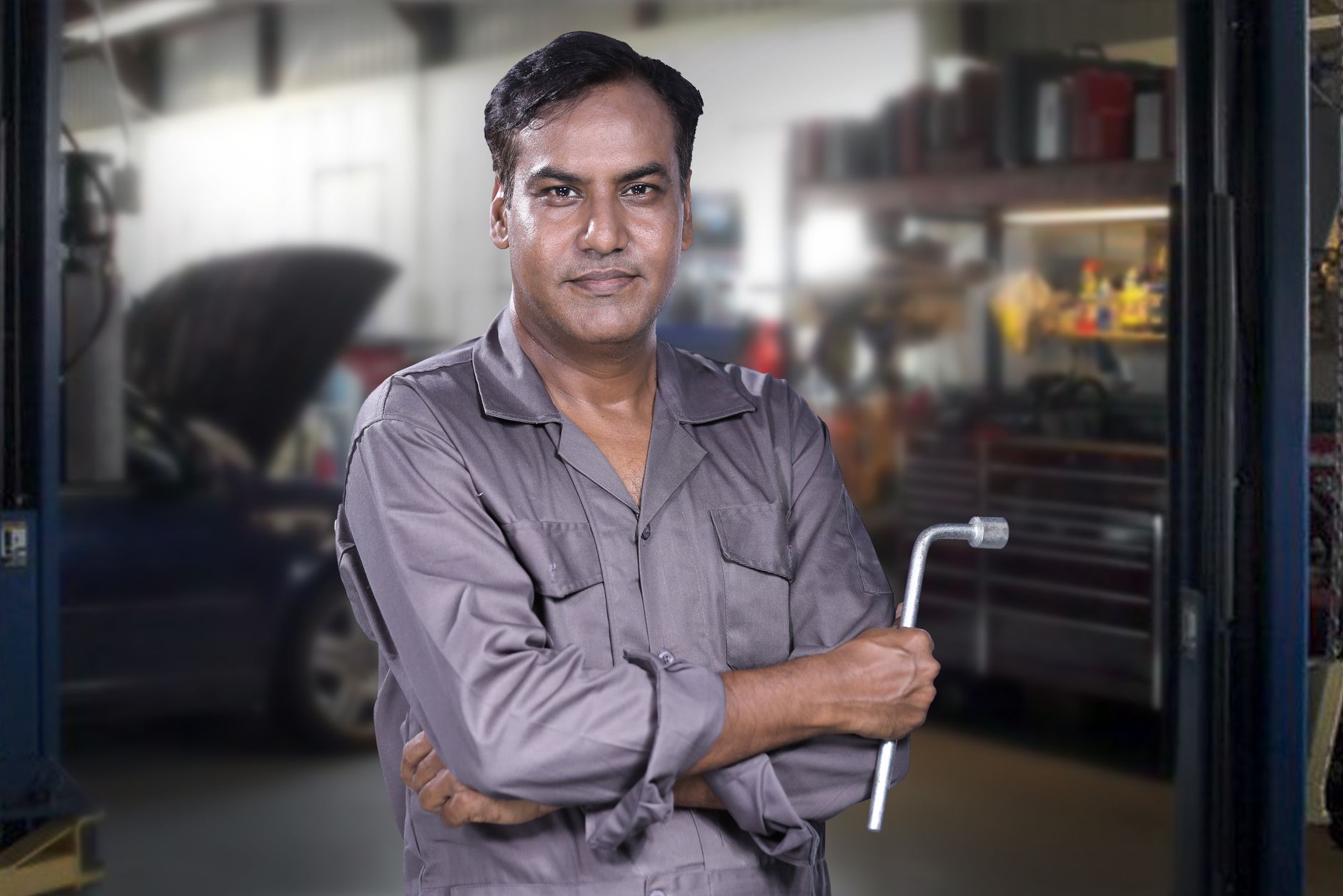 A Revline technician with a customer's car keys at the workshop