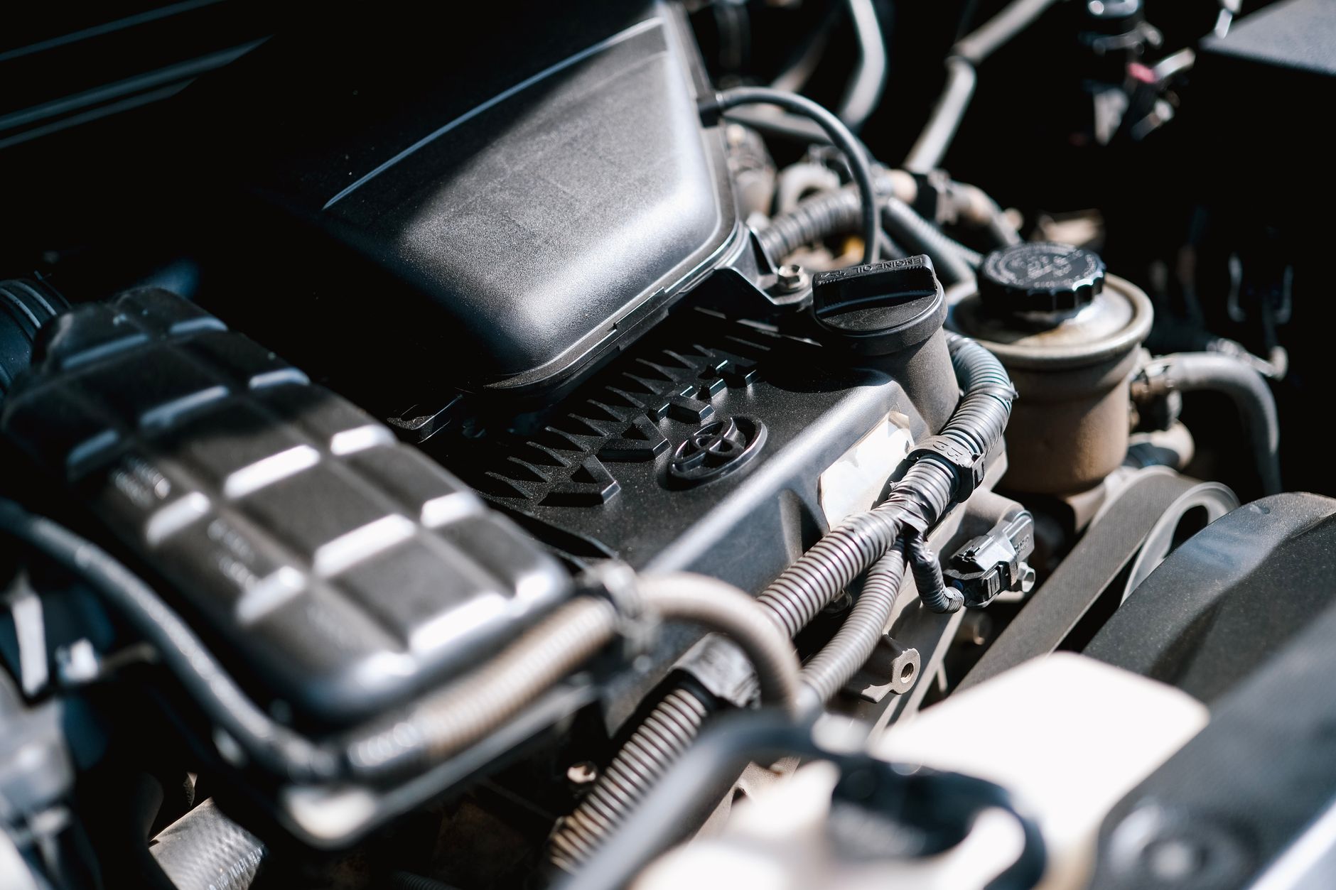 A car engine bay being serviced at Revline Garage