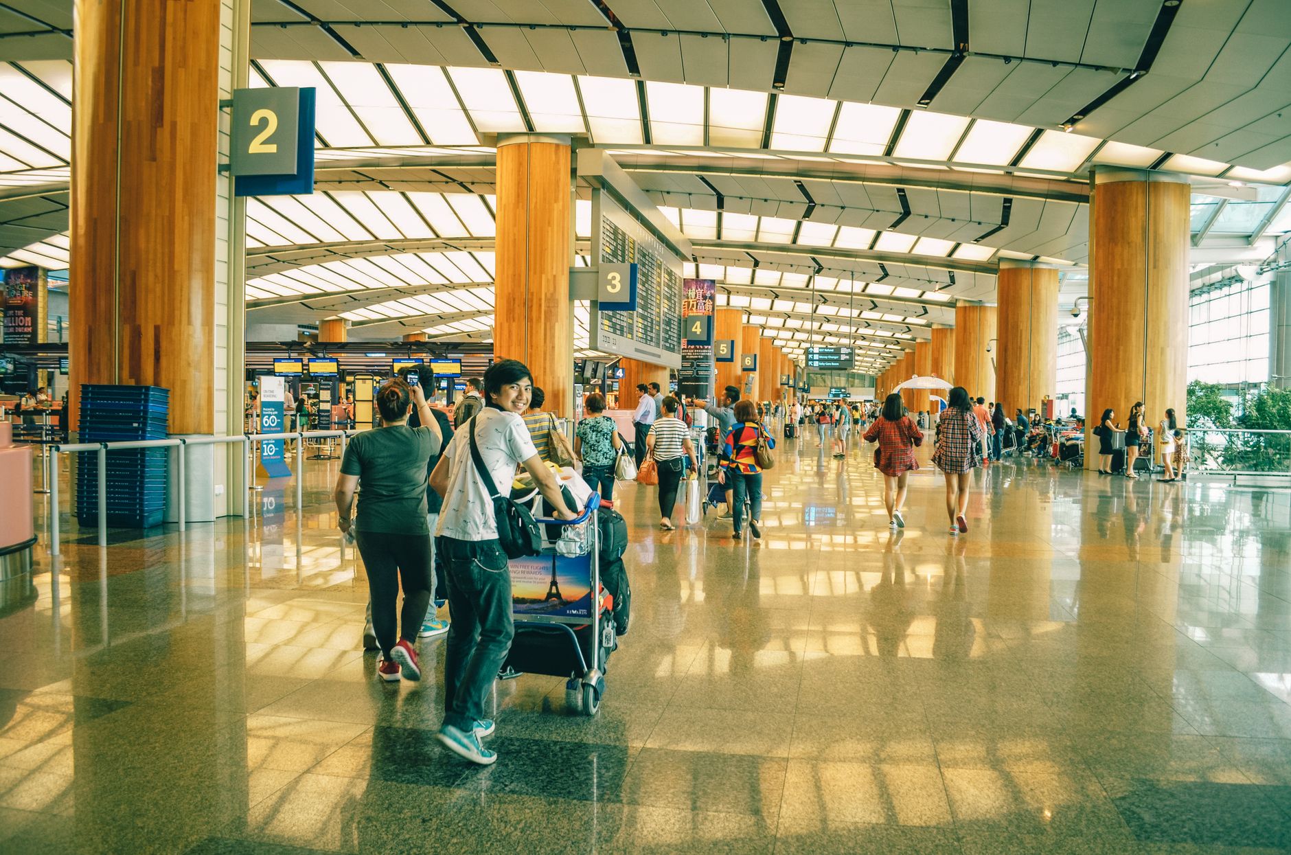 A Singapore family at the airport, covered by Roamsure travel insurance