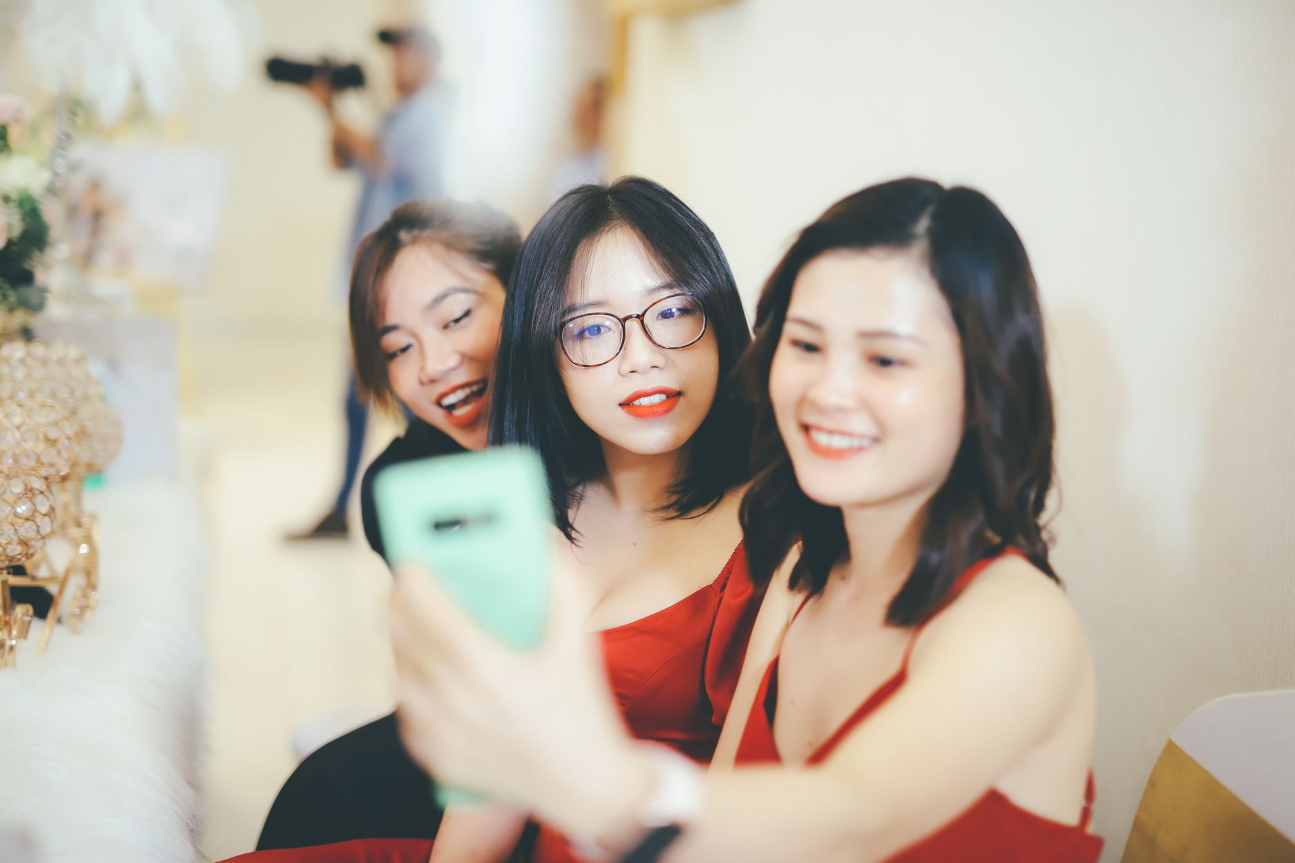 Friends posing together at a Singapore party photo booth