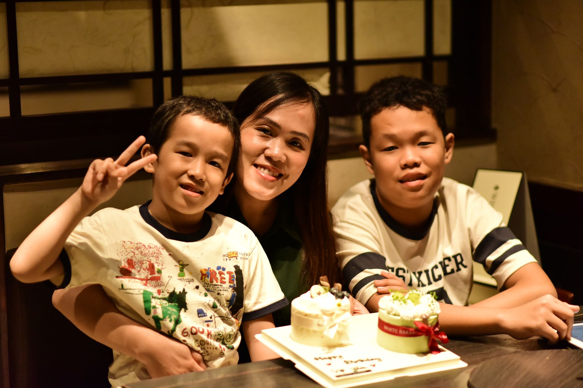 A family celebrating at an event with the Snapbox booth