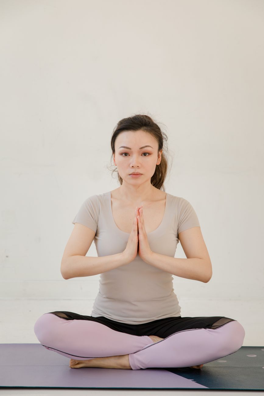 A calm yoga pose in a serene Singapore studio — Sukha Yoga