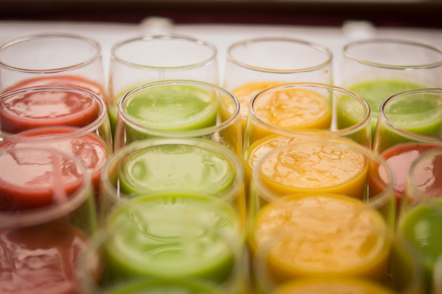 A bright row of freshly made cold-pressed juices and smoothies