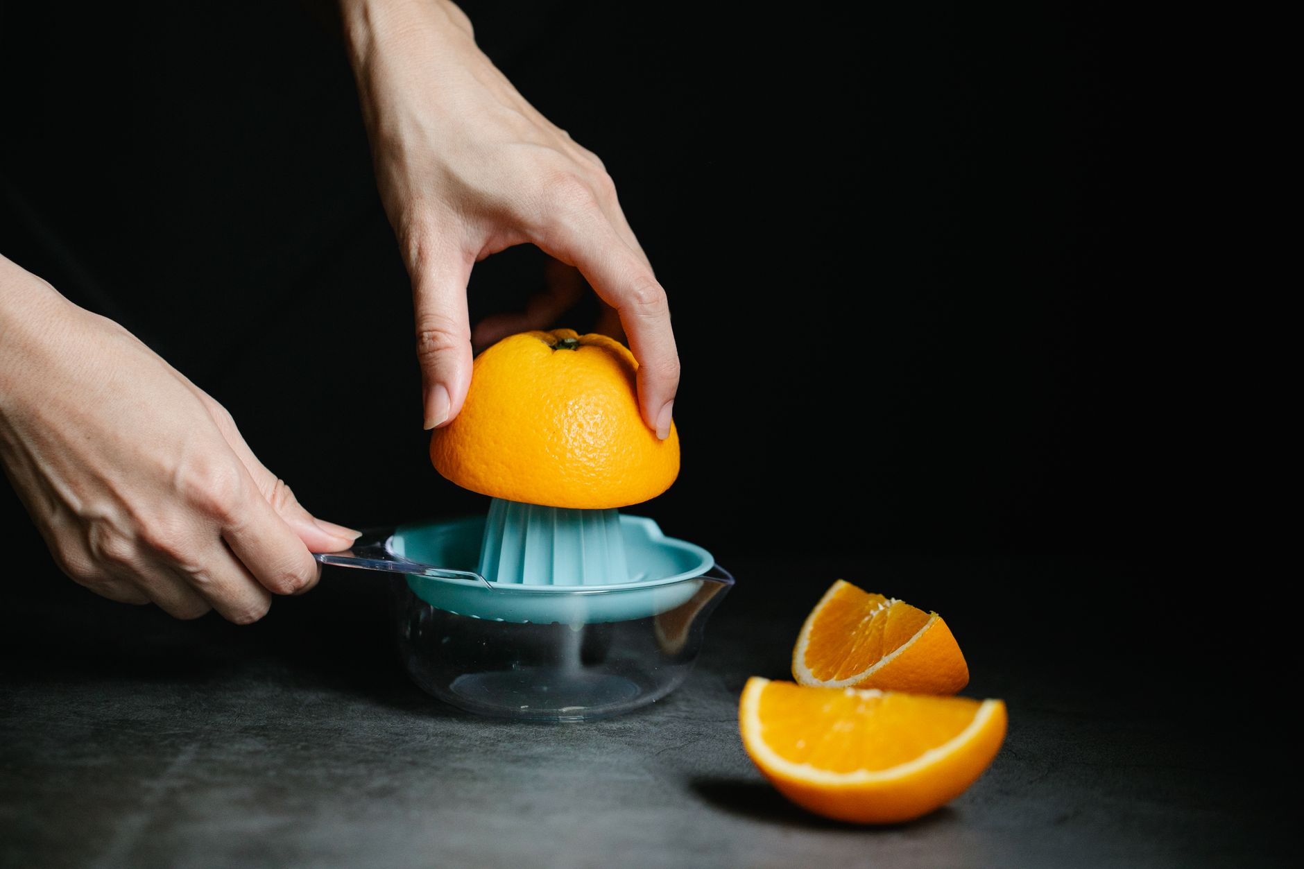 Fresh fruit going through a cold press