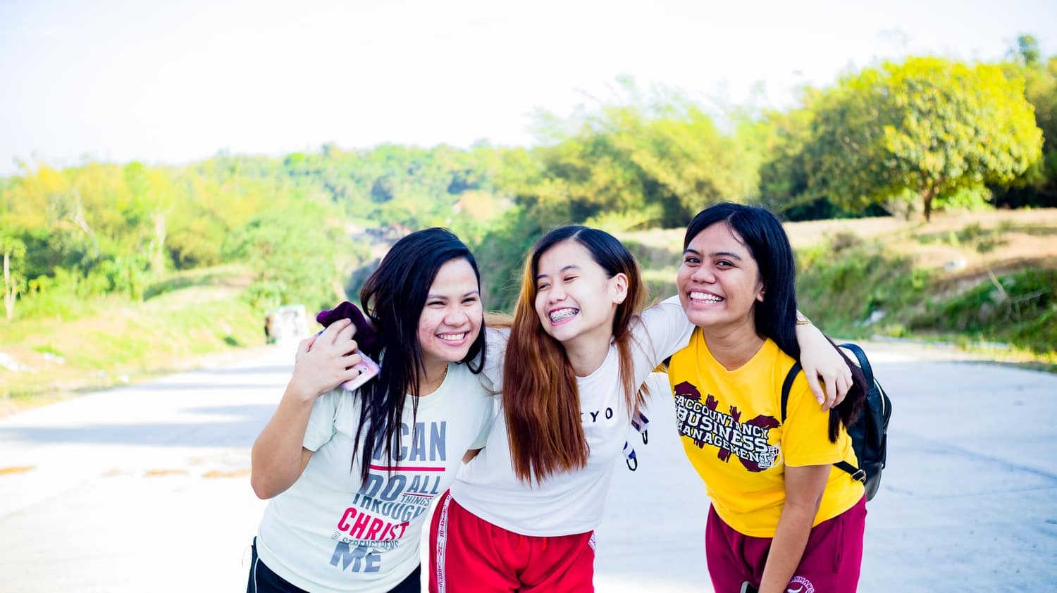 Friends wearing Threadlore graphic tees