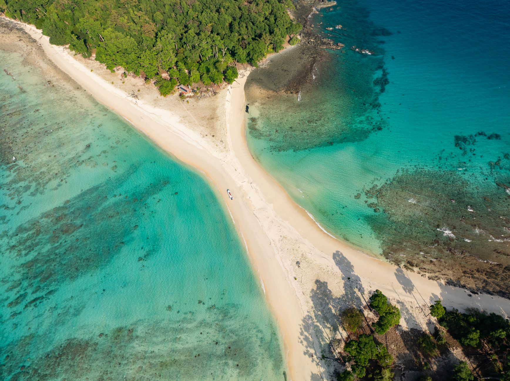 A turquoise tropical coastline at golden hour