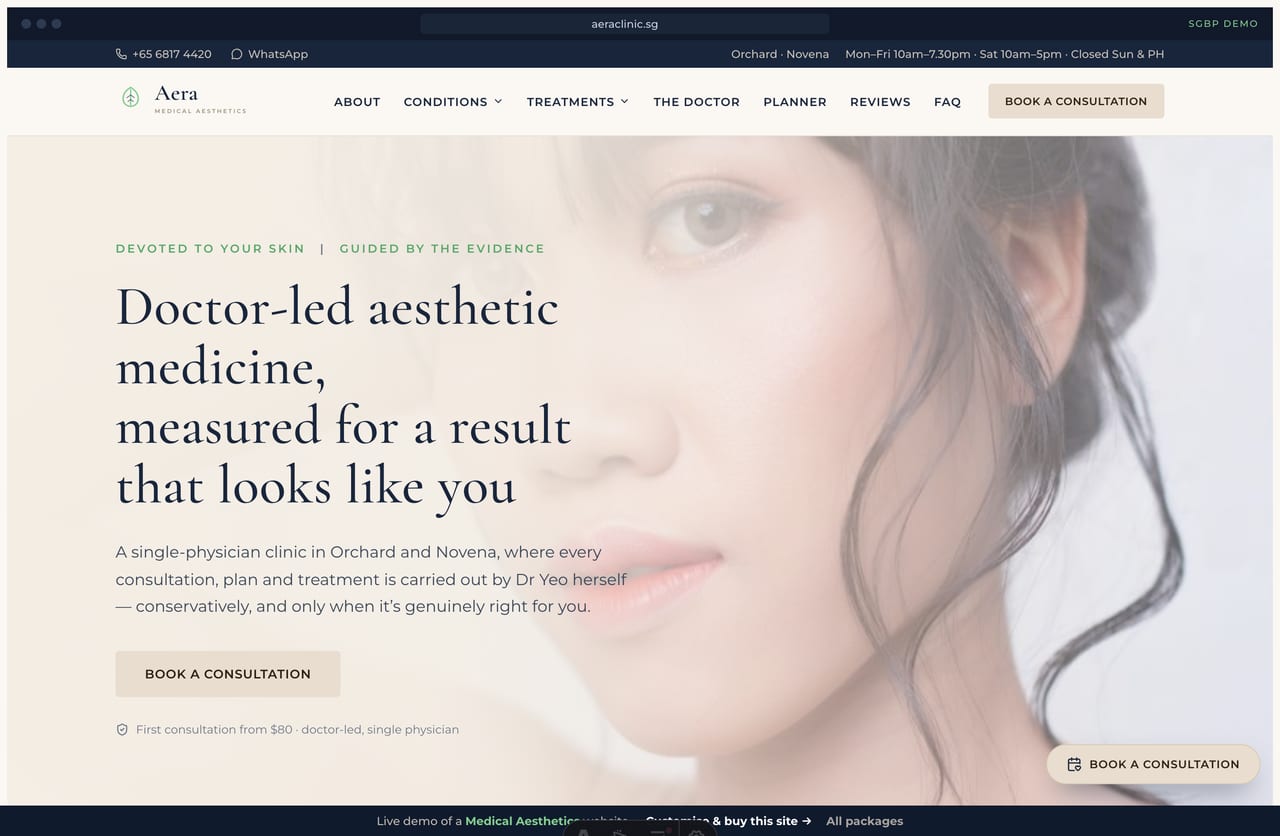 Aera medical aesthetics Singapore website homepage demo — a beige and navy clinical-luxe site with a serif hero, treatment-category cards and a doctor band