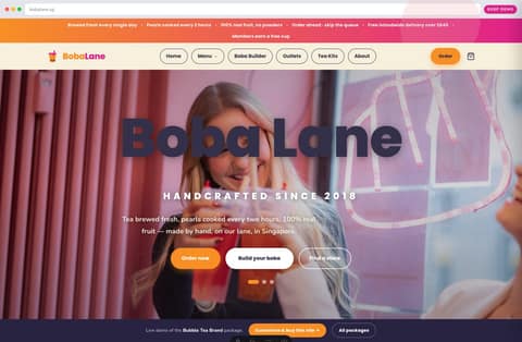Boba Lane bubble tea brand website homepage demo — full-bleed photo hero, playful pill nav and order-ahead promise (Singapore)