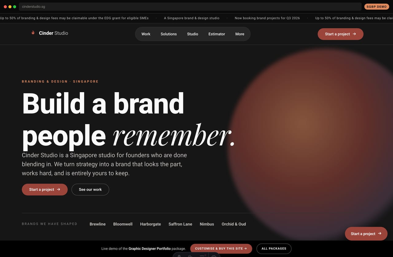Cinder Studio graphic-design & branding studio portfolio homepage demo — dark theme with a colourful case-study mosaic (Singapore)