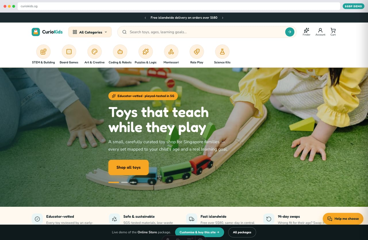 Curio Kids educational-toy online store homepage demo — wide hero carousel, rotating promo strip and round category-icon nav (Singapore)