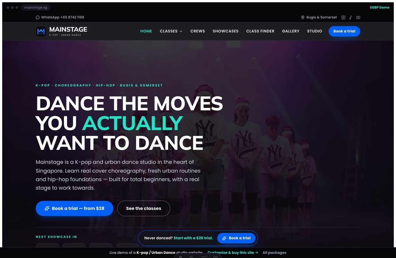Mainstage K-pop dance studio Singapore website homepage demo — a dark theatre hero with a next-showcase countdown, class cards and a Class Match Finder