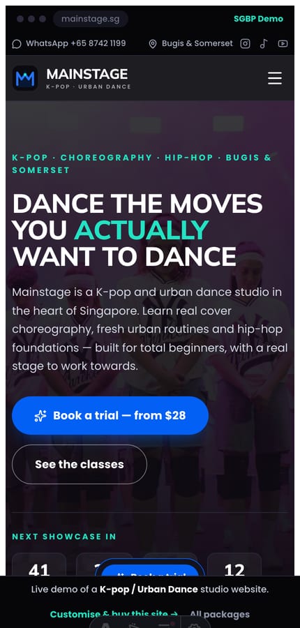 The Mainstage K-pop dance website on mobile — dark hero with a countdown and a sticky book-a-trial bar at 430px