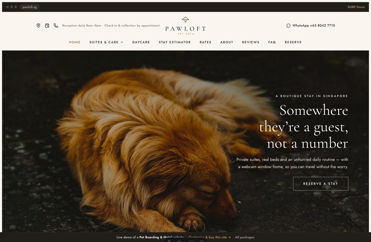 Pawloft pet hotel Singapore website homepage demo — a warm cream and gold site with a full-bleed photo hero, centred serif section heads and suite cards