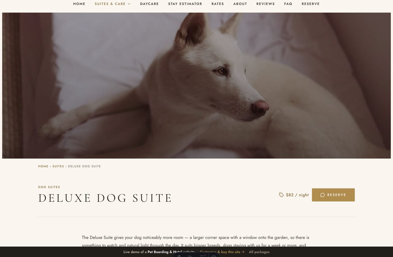 A suite detail page on the Pawloft demo — a full-bleed photo banner, an uppercase serif title and a two-column includes-and-good-to-know layout