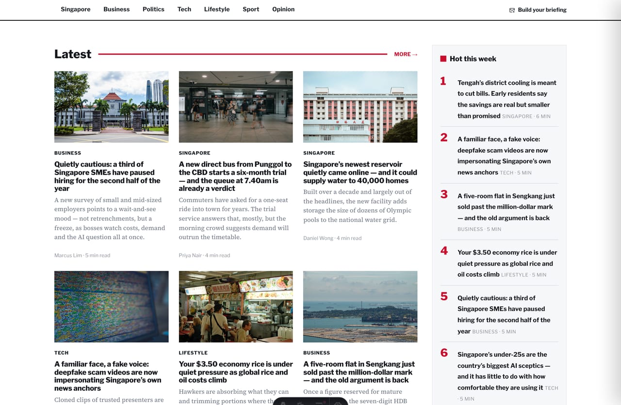 Dense multi-column article-card grid with red category tags on a Singapore news site