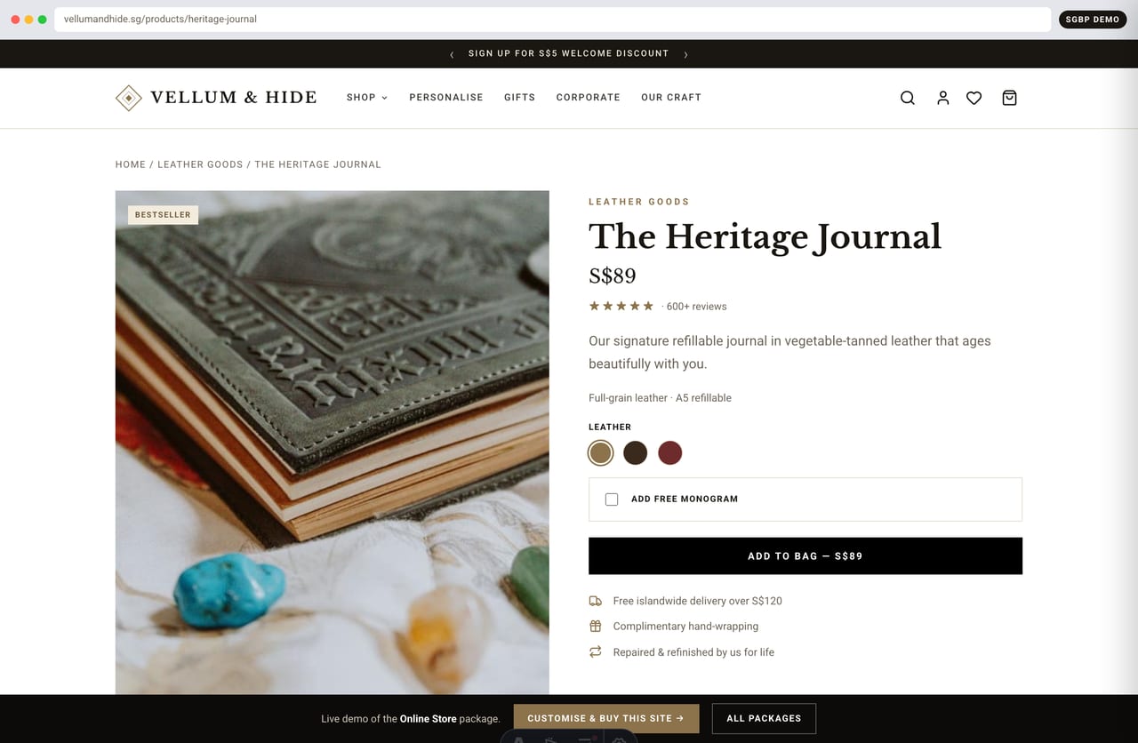Product detail page for a full-grain leather journal with colour options, monogram picker and SGD price