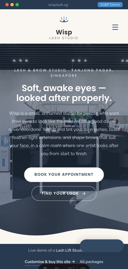 The Wisp lash-lift-studio website on mobile — wave-divider hero and a floating Book tab at 430px